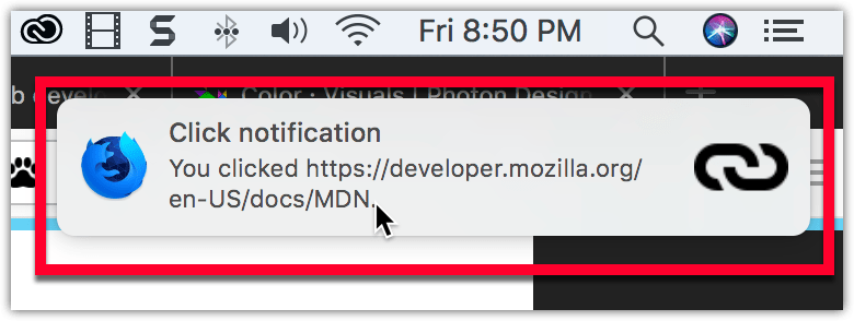 在 macOS 上的示例通知：通知位于系统时钟下方，有一个粗体标题“Click notification”，接着是一段正常字体的文本“You clicked https://www.supremezsy.dpdns.org/en-US/docs/MDN”。通知的左侧有 Firefox Nightly 的标志，右侧有一个链接图标。